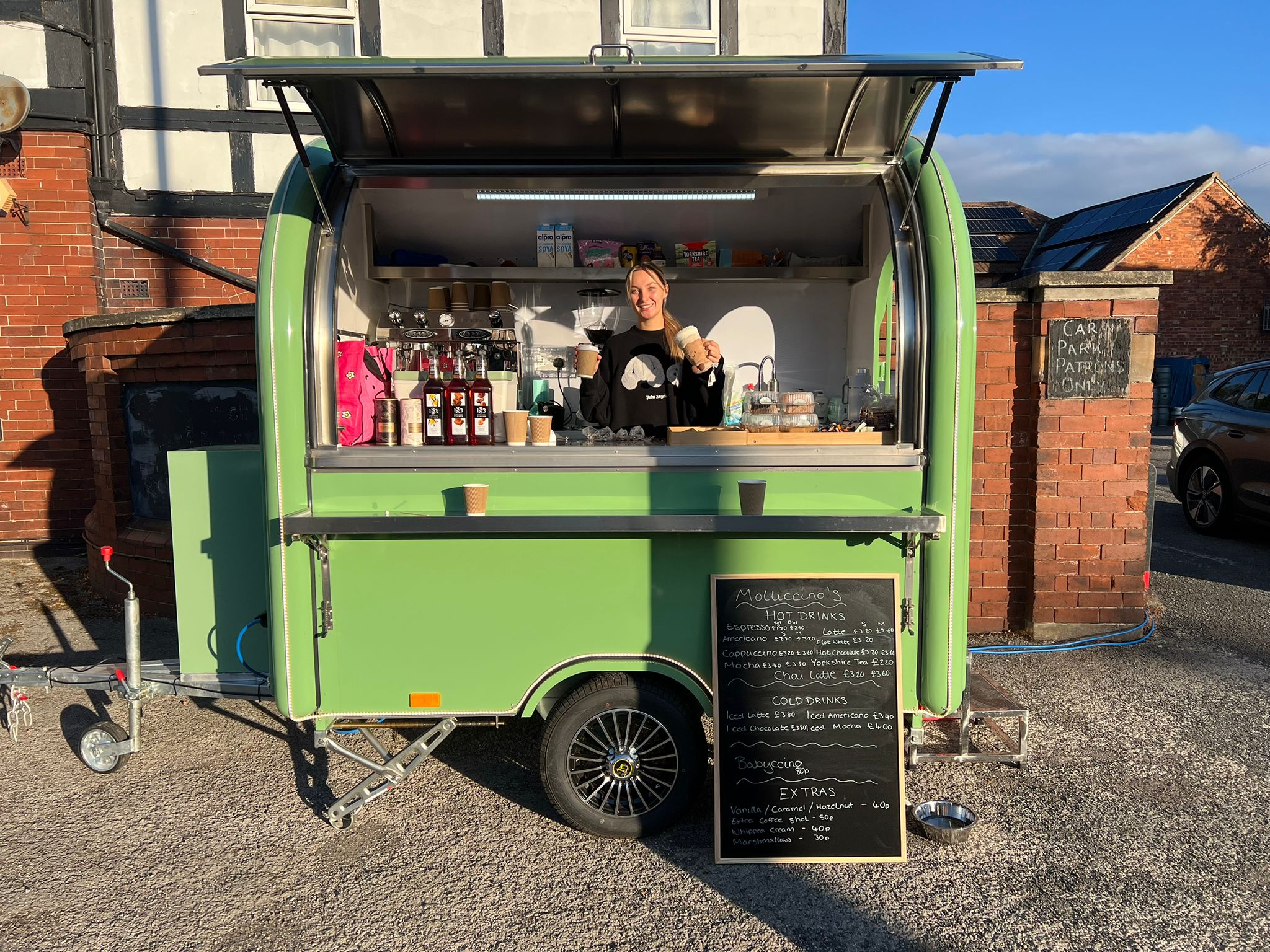 Molly smiling at the Molliccino's espresso trailer